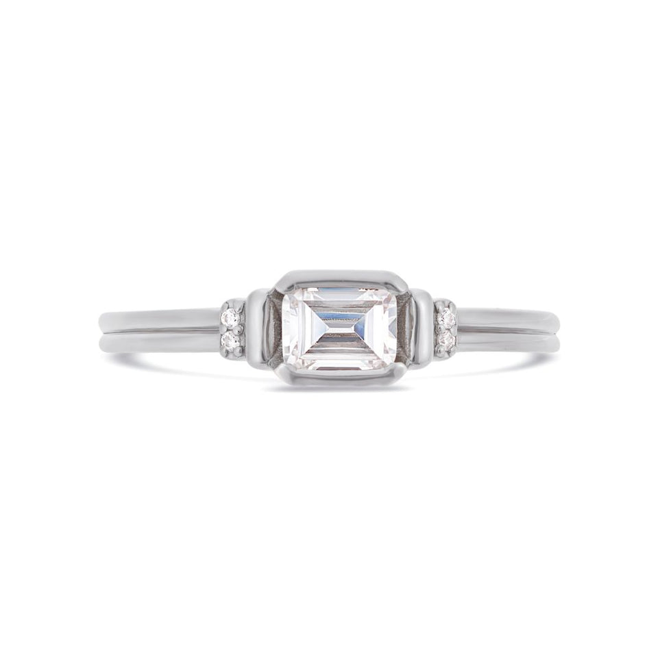 Deco emerald cut solitaire diamond ring in platinum