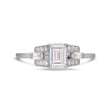 Emerald cut diamond buckle ring in platinum