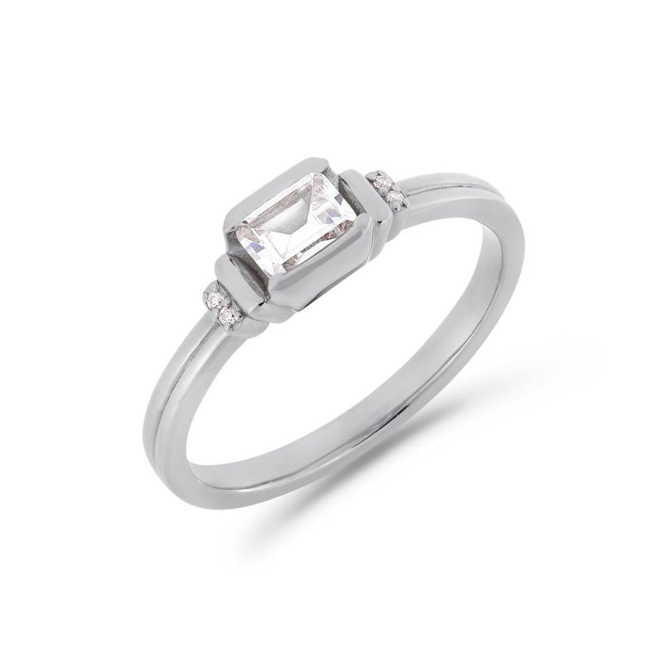 Deco emerald cut solitaire diamond ring in platinum